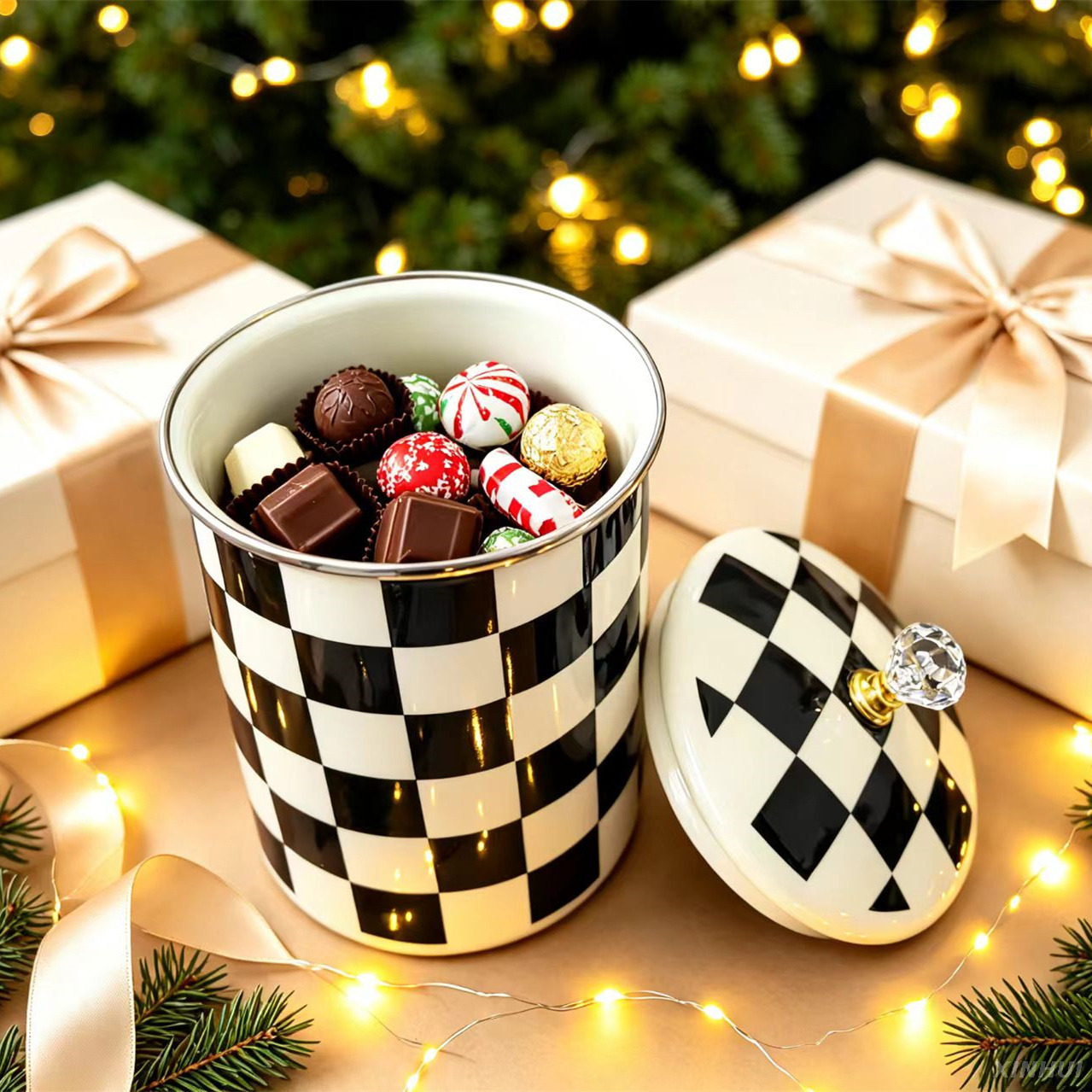 Cute checkered mug holding marshmallows and hot cocoa accessories