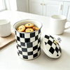 Enamel cookie jar filled with biscuits on kitchen counter