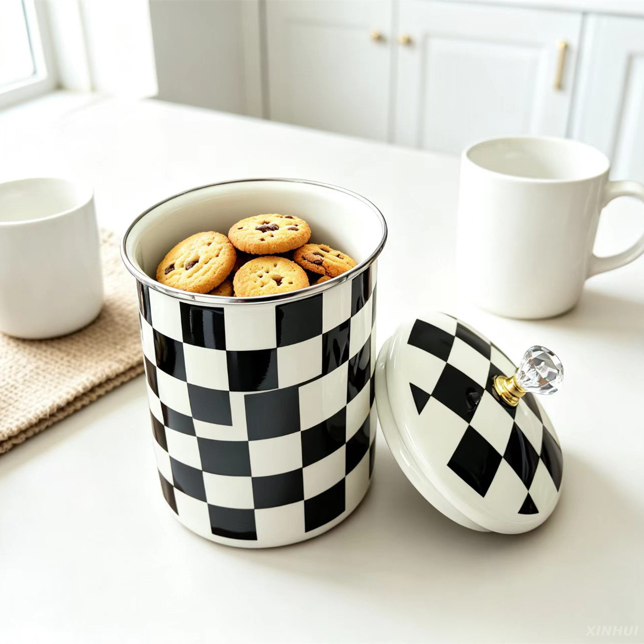 Enamel cookie jar filled with biscuits on kitchen counter