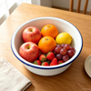 Classic enamel basin manufactured by enamel factory for fruit storage and serving